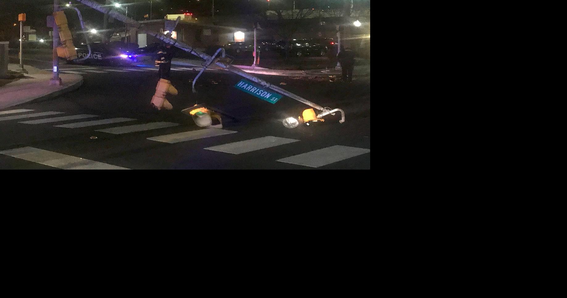 UPDATE: Driver charged after truck hits pole, knocks down signal lights ...