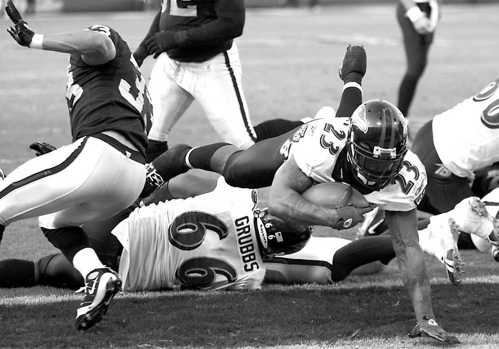 Baltimore Ravens running back Willis McGahee (23) is tackled by