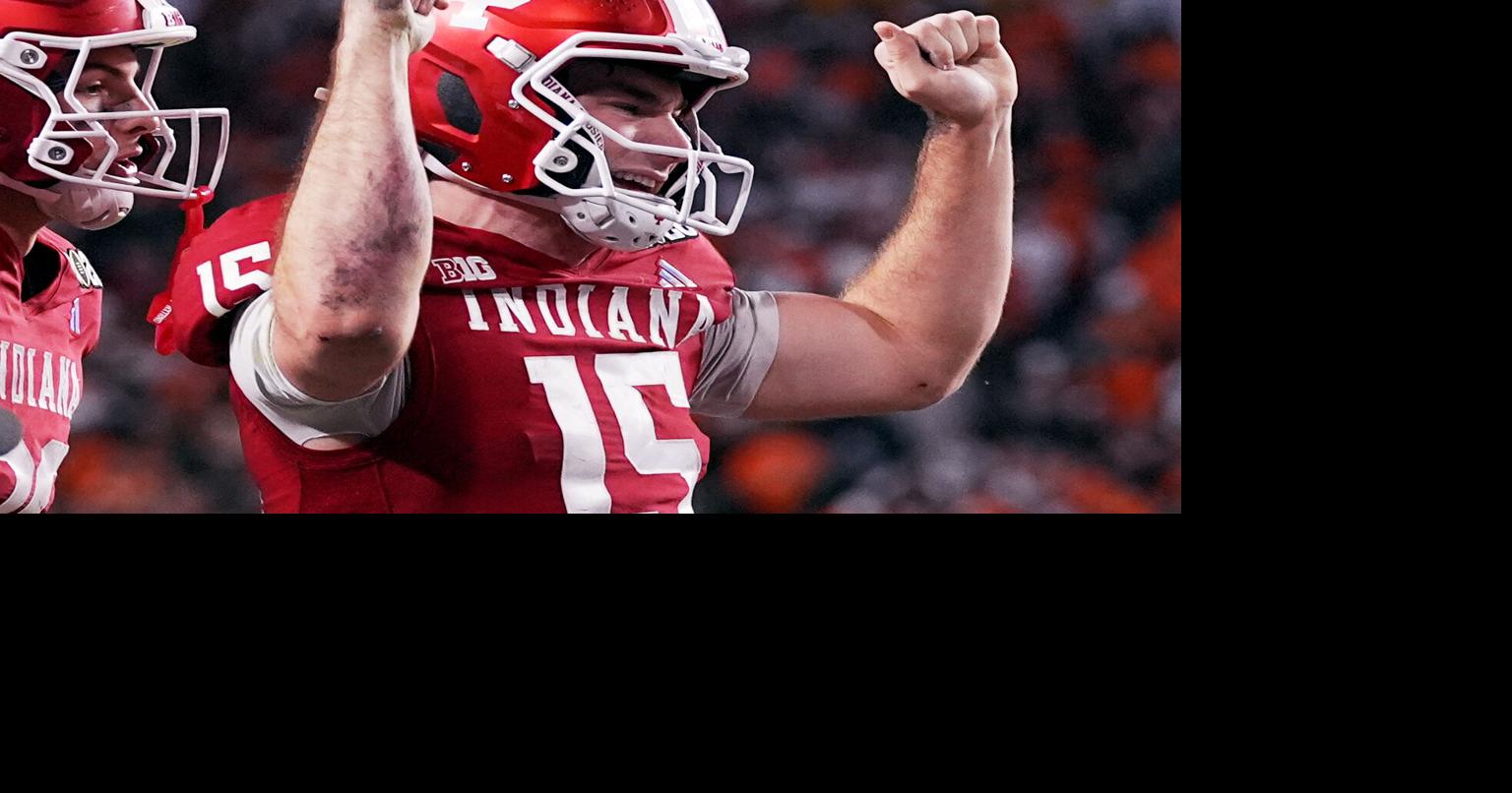 Indiana completes undefeated season and wins first national title, beating Miami 27-21 in CFP final