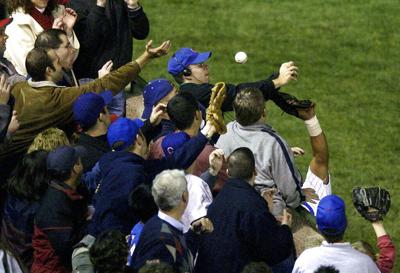 This Date in Baseball - Steve Bartman, a Cubs fan, reaches for a foul ball,  deflects a potential out