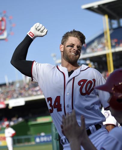 Bryce Harper hits 1st slam, 100th HR in Nationals win over Braves