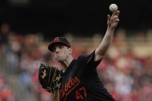 Means tosses seven shutout innings in season debut, Orioles beat Reds 2-1; Pirates win, Nationals lose