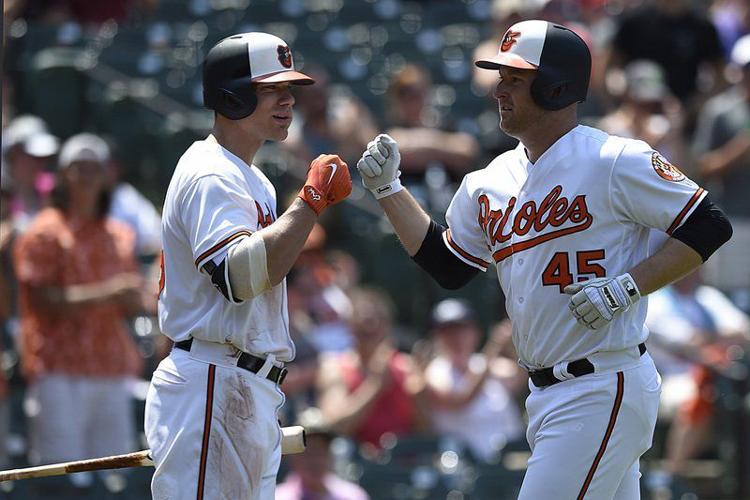 Chris Davis, Buck Showalter and Scott Coolbaugh react to tension