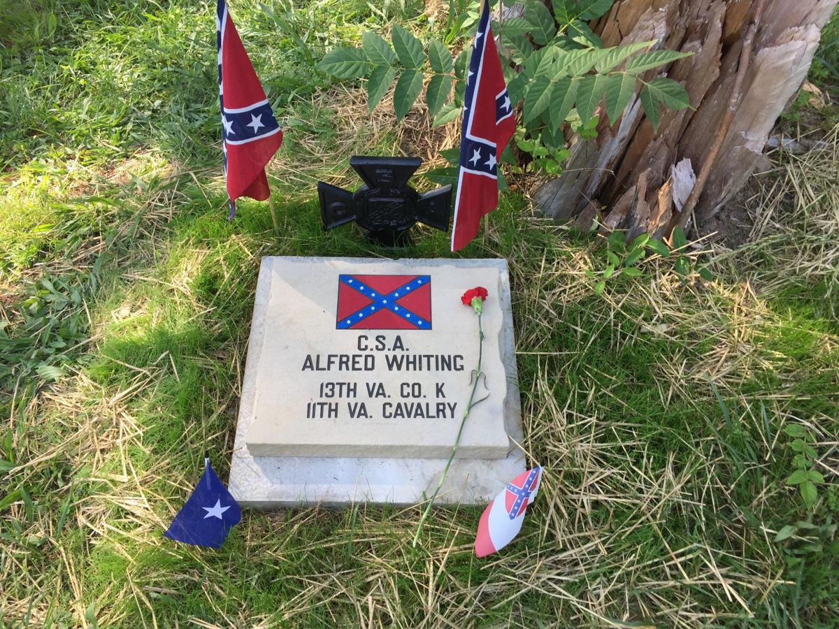 Confederate flags placed in AfricanAmerican Romney cemetery Local