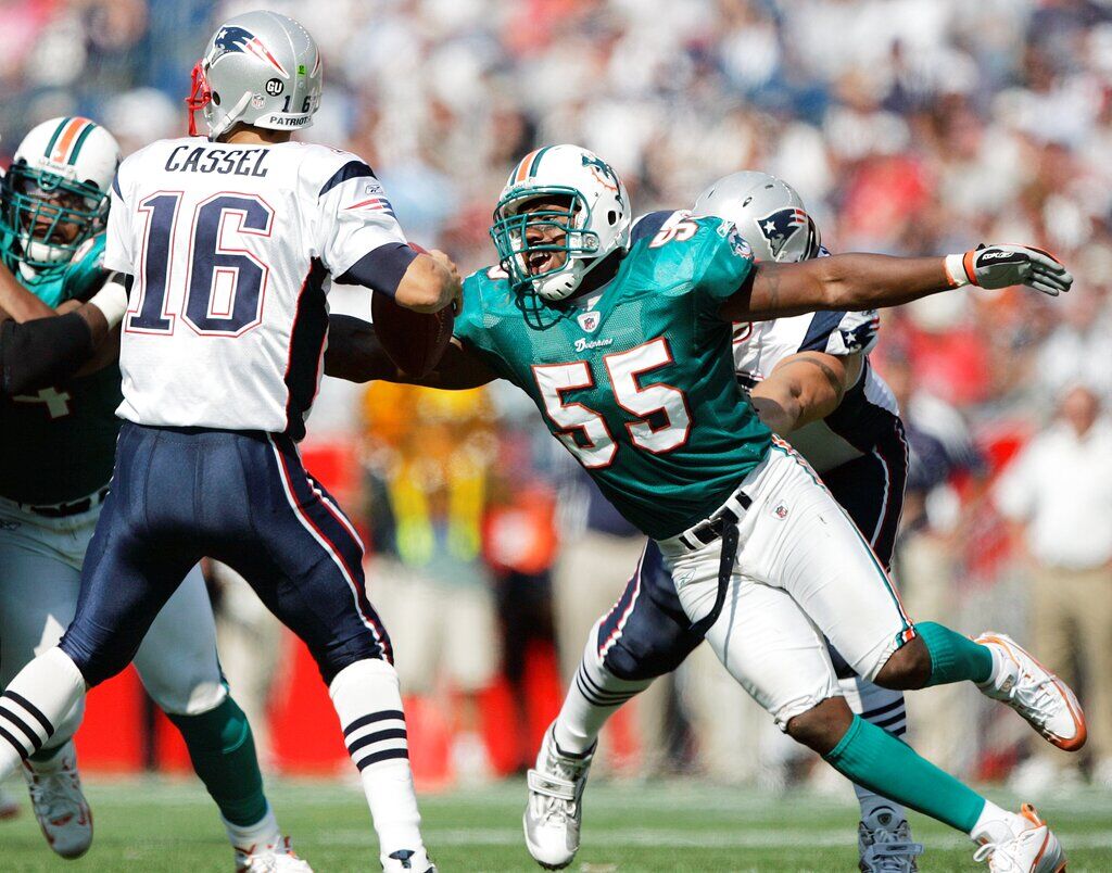 Ronnie Brown of the Miami Dolphins warms up before The Baltimore