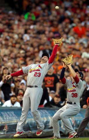 St. Louis Cardinal centerfielder Jim Edmonds smashs into the wall