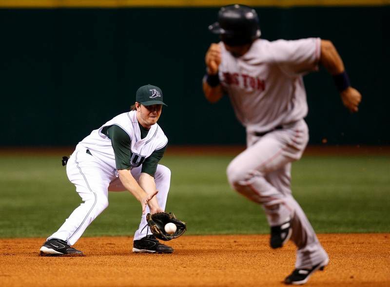 Oakland Athletics' Jack Cust gets a high five after hitting a two