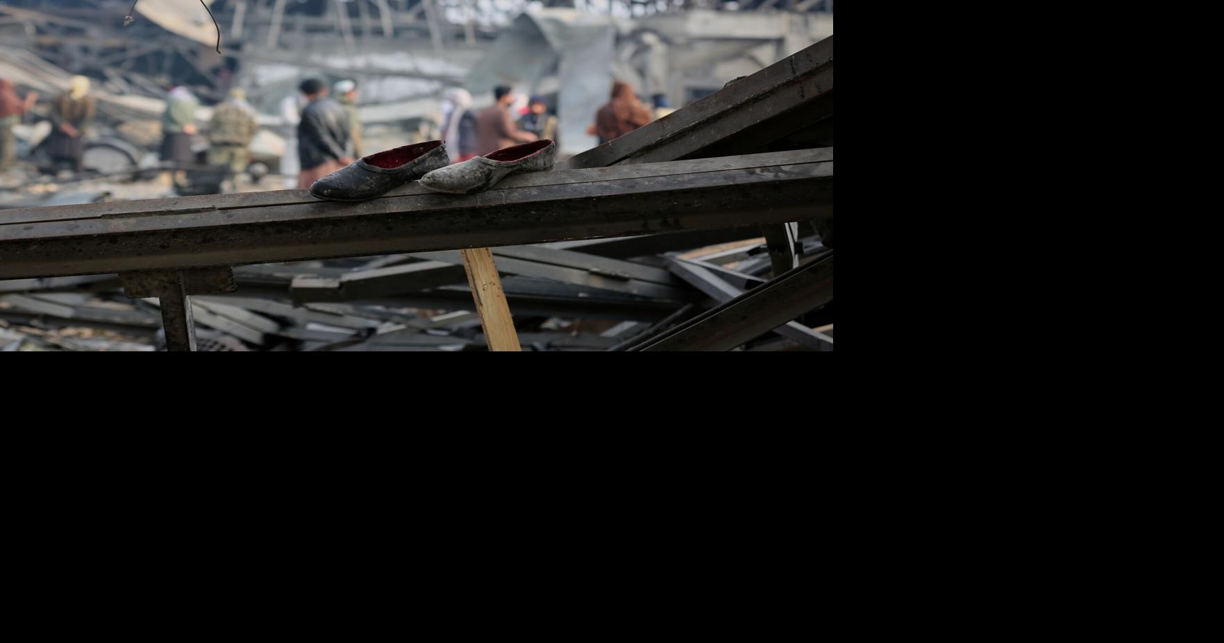 Rescue crews race through rubble after a deadly Kabul airstrike, in photos