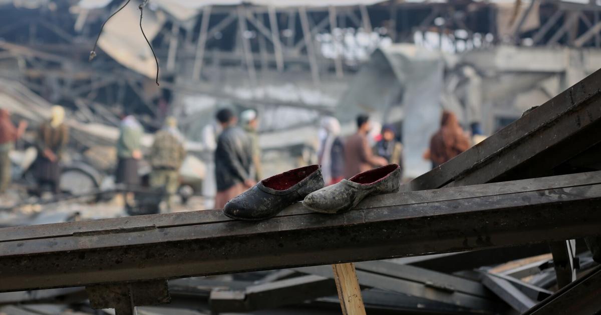 Rescue crews race through rubble after a deadly Kabul airstrike, in photos