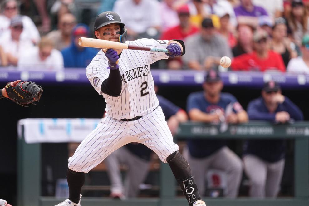 Freeman's bunt drives in go-ahead run, Carrigg has 3 RBIs as Rockies rally past Red Sox