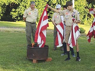 Disposed with honor... Local Scout troop holds flag retirement ceremony ...