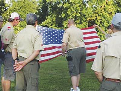 Disposed with honor... Local Scout troop holds flag retirement ceremony ...