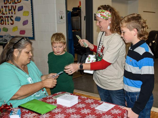Cookies with Santa event at Appomattox Elementary School raises memorial scholarship funds