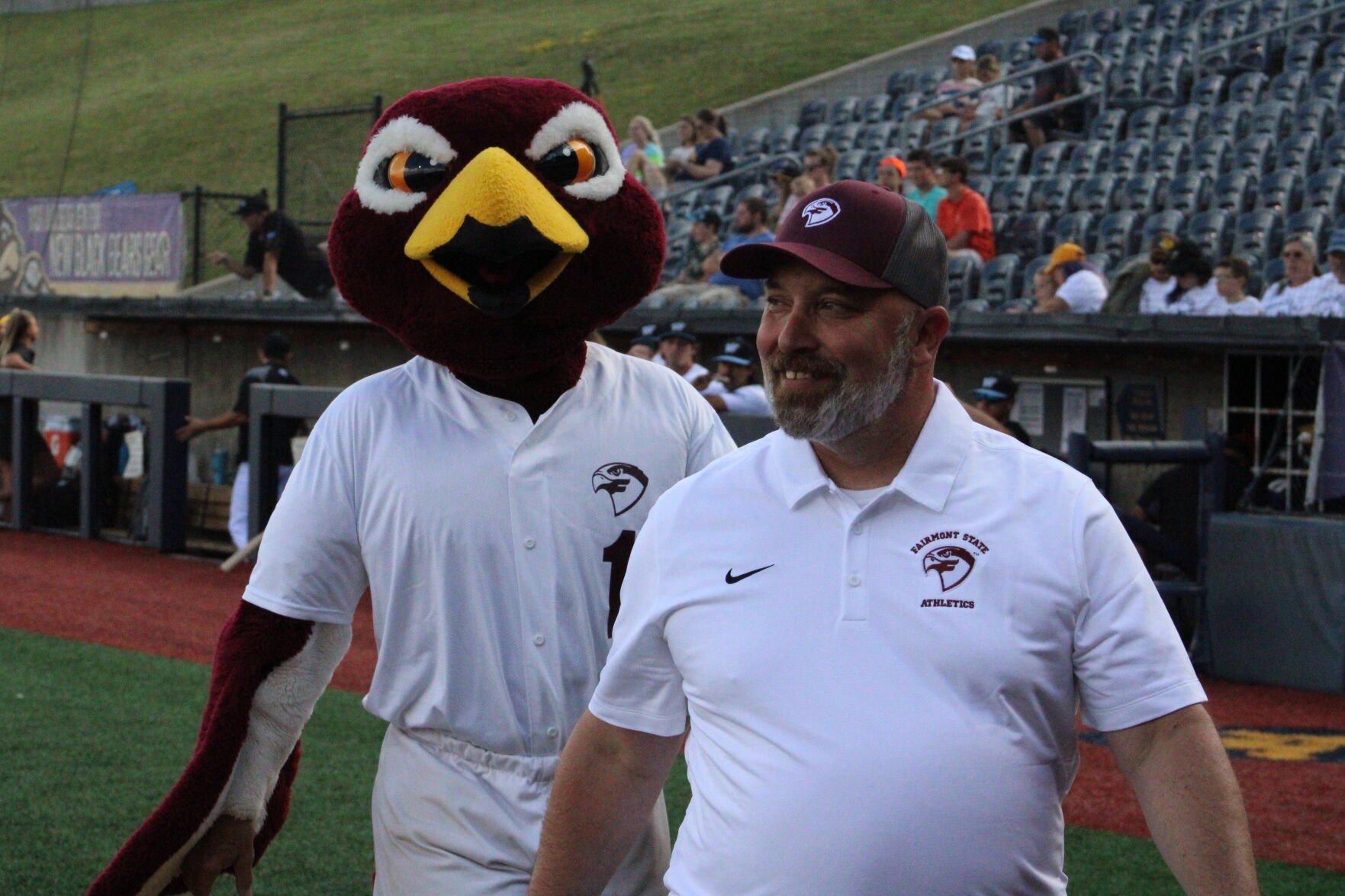 Fairmont State University President Mike Davis, right, and the Alumni Association hosted alumni, faculty and staff at a West Virginia Black Bears game Thursday.