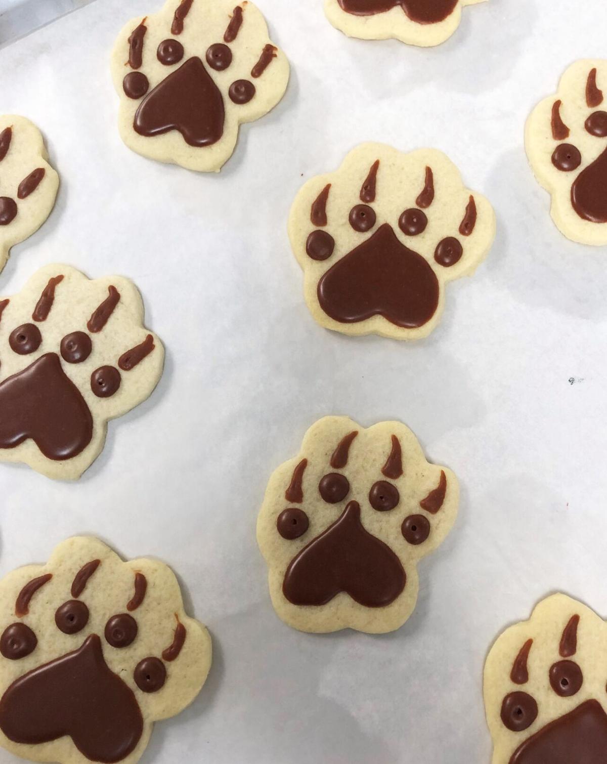 Marsha Kisner, owner of Baker's Nook in Farmington, makes cookies for Huskies fans.