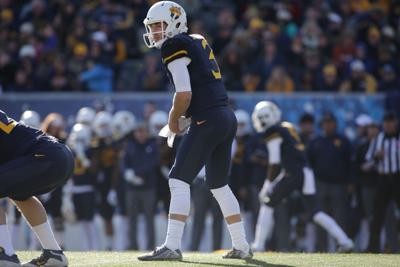 COLUMN: Antiquated rules for an evolving, modern game. The helmet rule must  go., WVU Mountaineers
