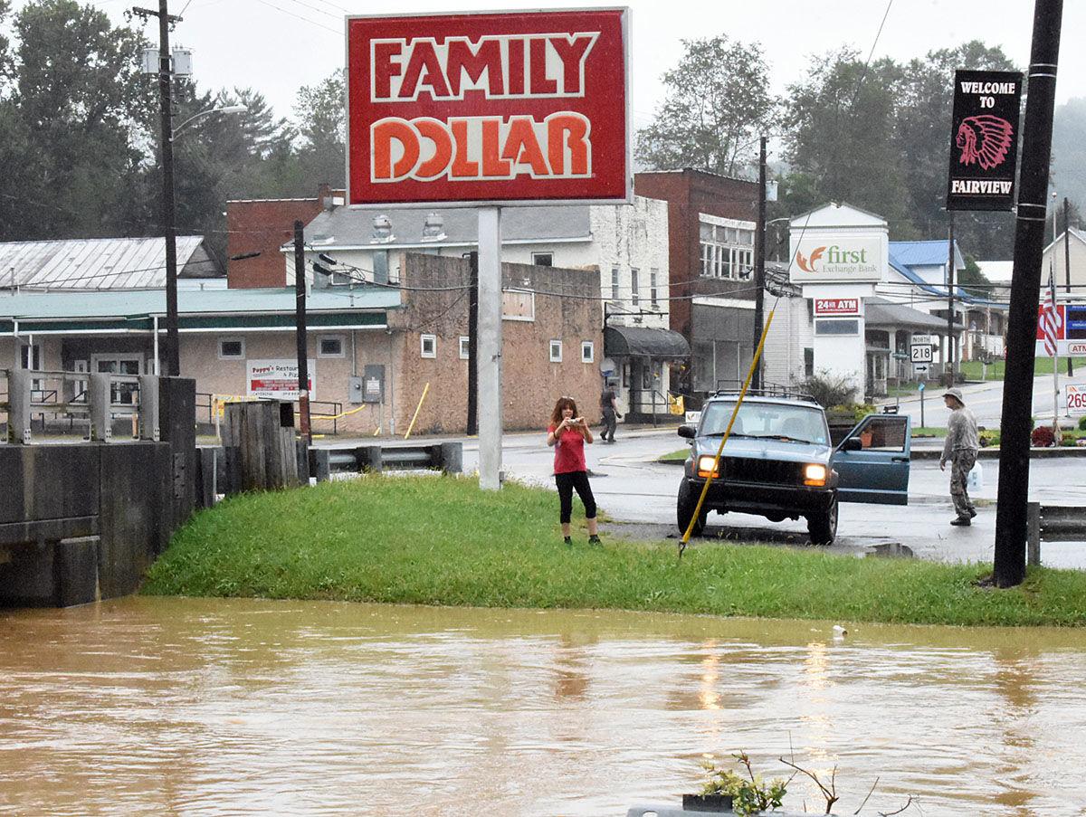 Flooding in Fairview Creeks overflow, pooling in yards, blocking roads