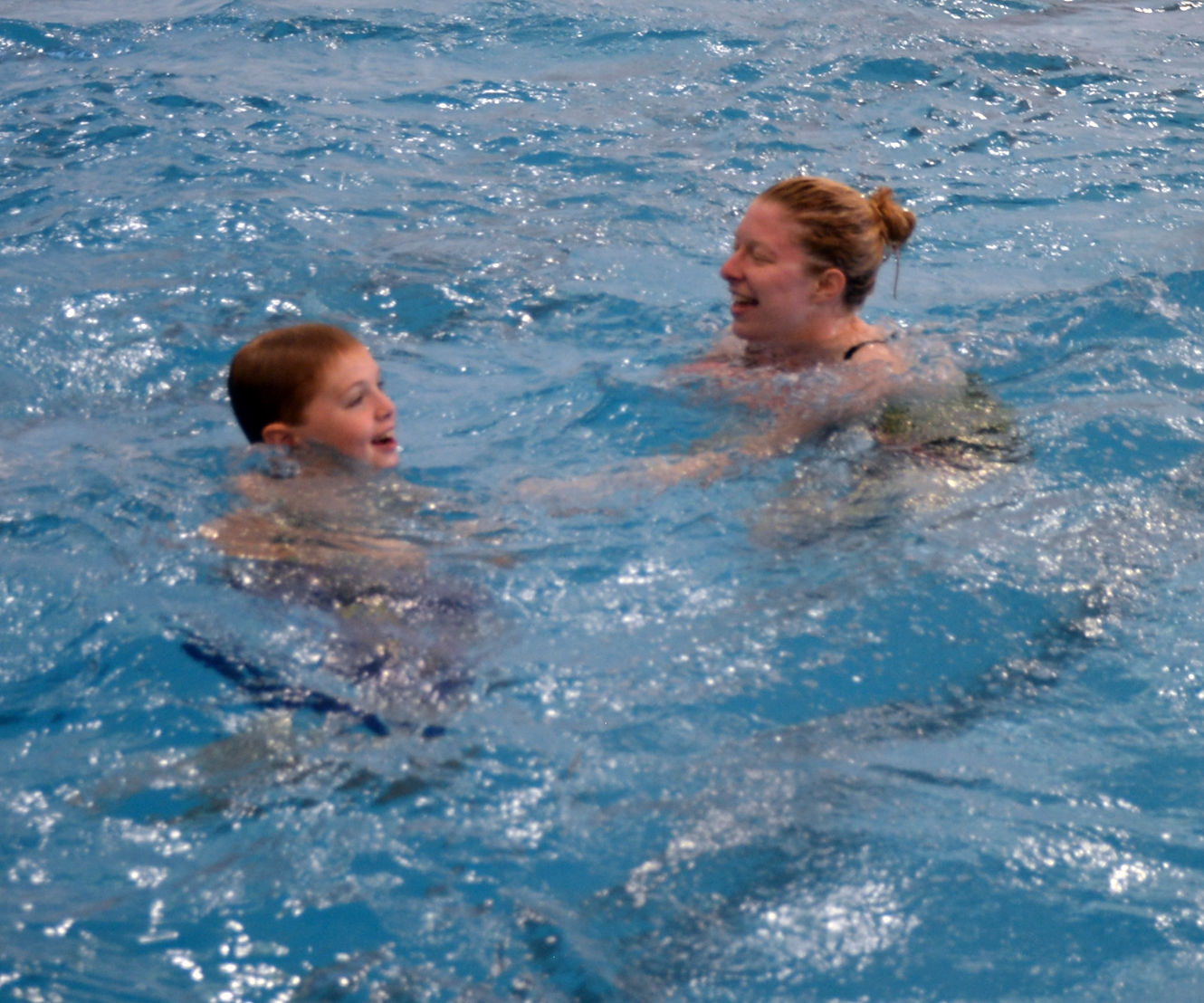 FSU swimmers pair with Autism Society for swimming lessons fun