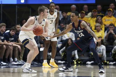 Sherman scores 23, West Virginia beats No. 15 UConn 56-53 ...