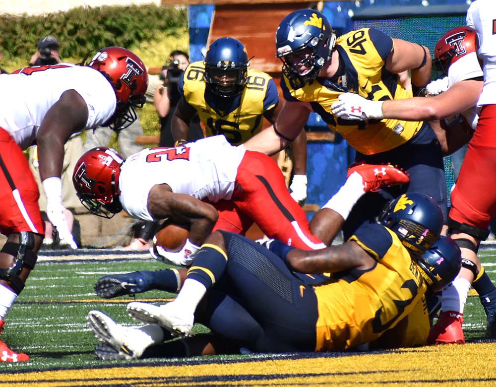 Grier throws 5 TDs as WVU erases second-half deficit to defeat Texas