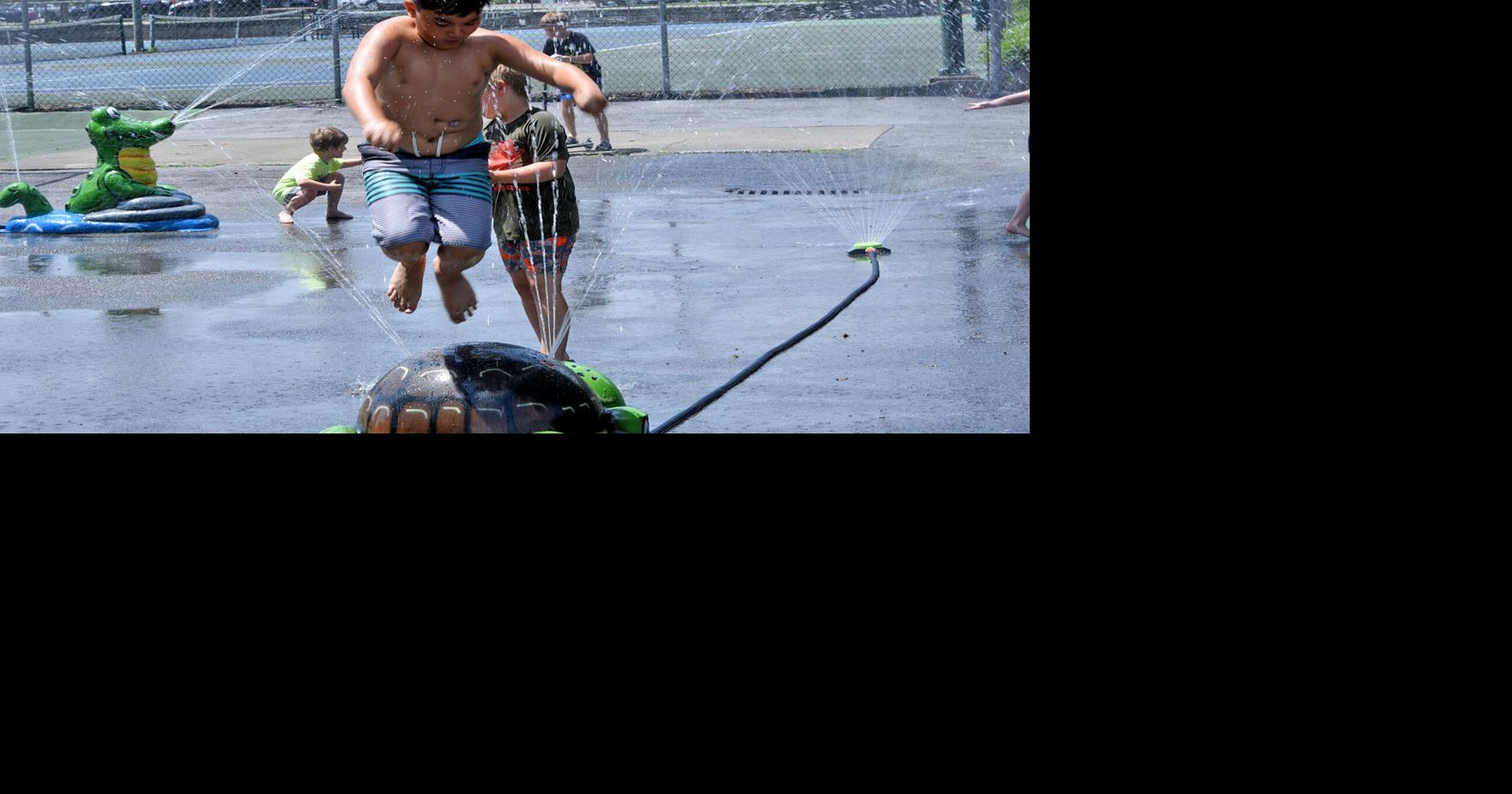 Fun in the park: Sprinklers offer cooling option while pool is closed
