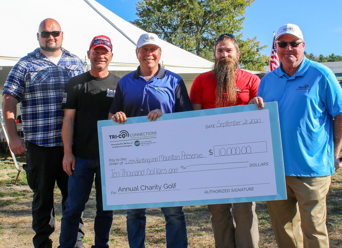 Tri-County Electric presents LEEK with check