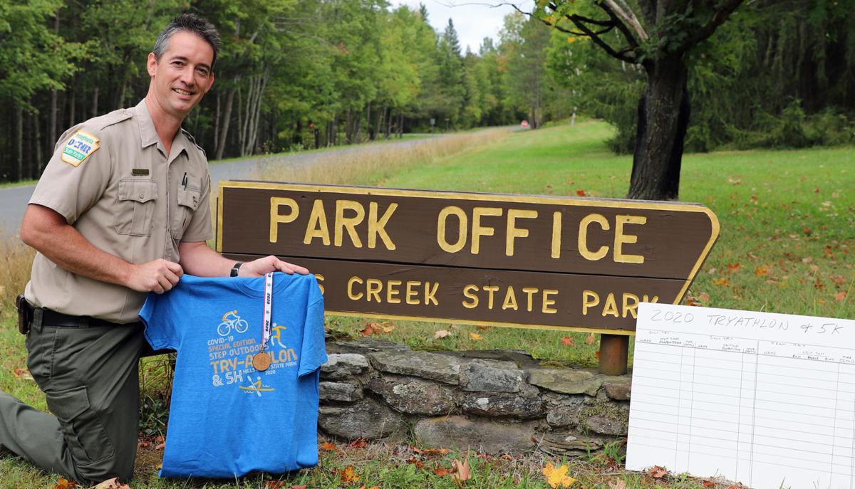 Tim Morey displays event shirts