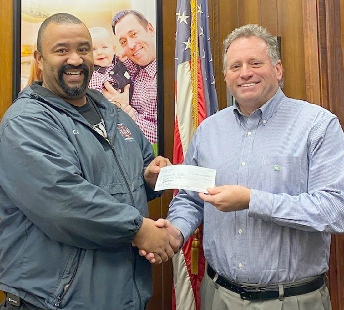 Rotary donates to Lawrenceville fire rebuild