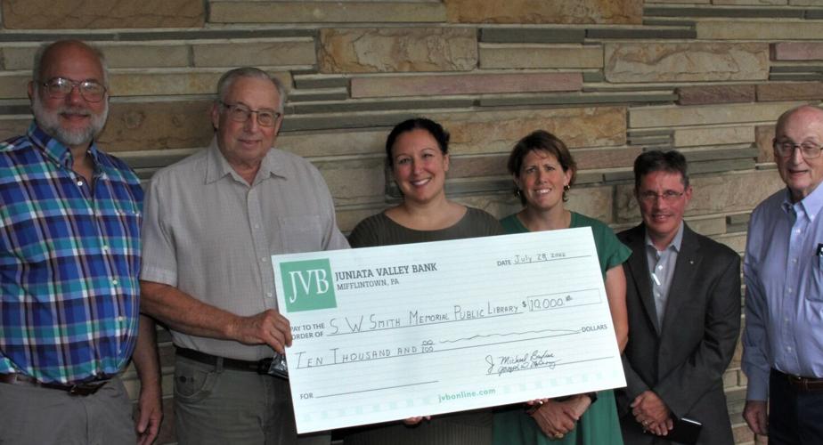 Rotary presents library check
