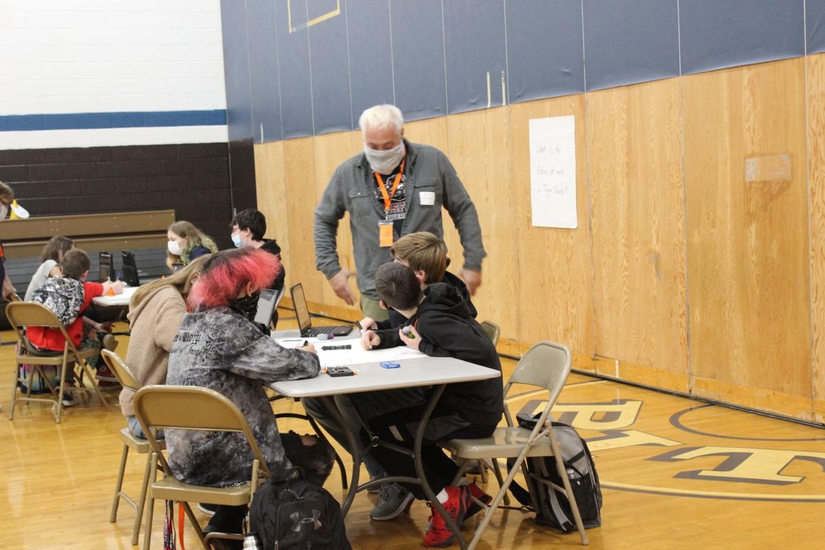 Community volunteers assist at educational workshop