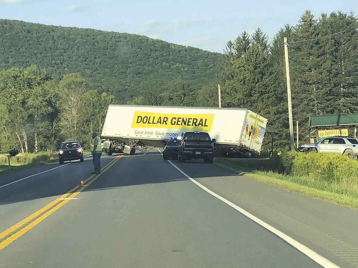 Truck driver cuts turn too close
