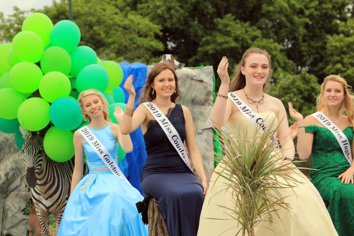 Queens ride atop float