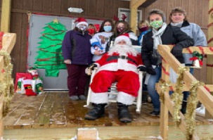 Santa hands out stockings