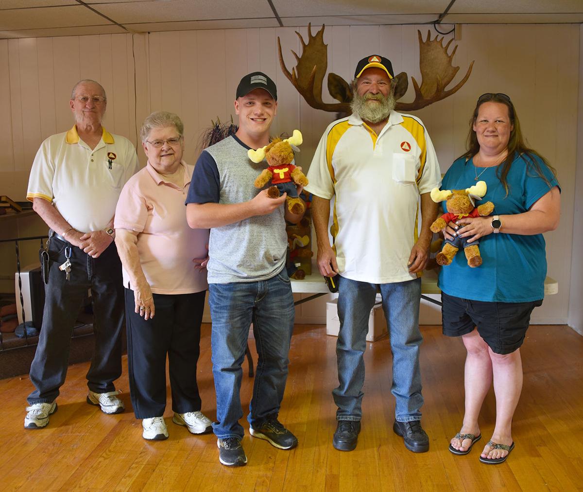 Moose presents toys to emergency responders