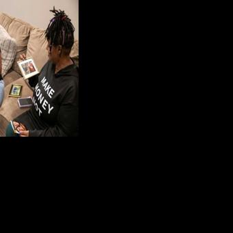 Reba Paul (L) and Stephanie Fairweather share memories of their late brother Denton Loudermill Jr. in Olathe, Kansas