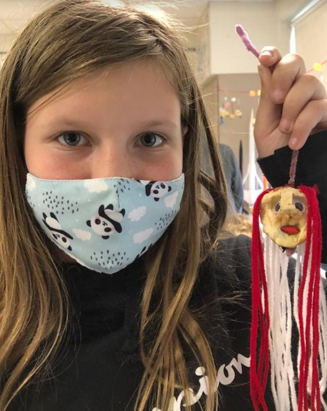 Students create shrunken apple head for math lesson