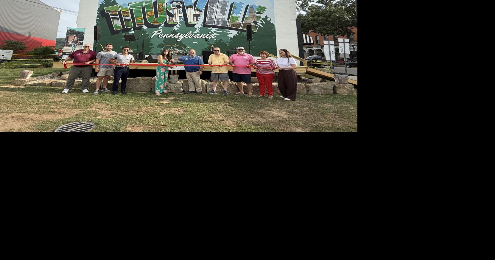 Community members, mural artist hold ribbon cutting to celebrate mural, stage