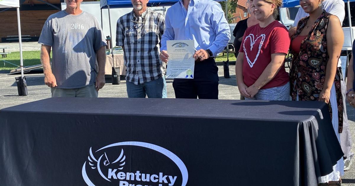 Shell presents Farmers Market with big check