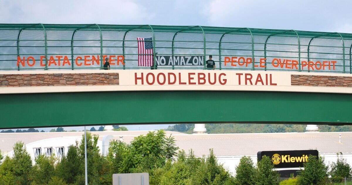 Activist groups join forces to hang message to data center developers, Amazon