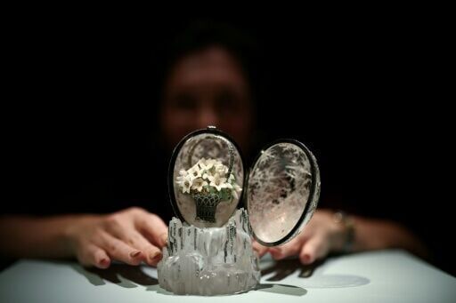 The entire piece including its base measures a mere 14.2 centimeters in height.