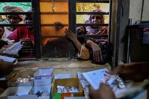Volunteers run a free pharmacy Al-Nao hospital, the capital's main functioning health facility