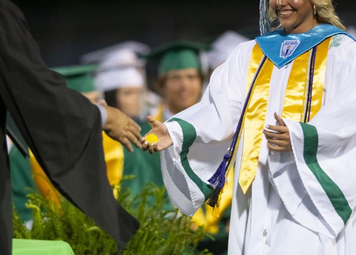 PHOTOS: Golfball handshake for graduation