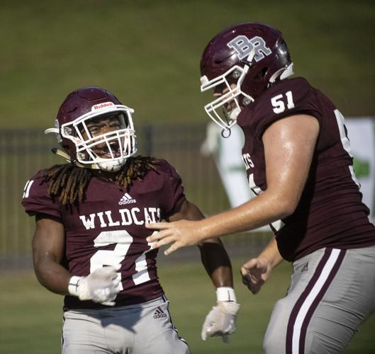 PHOTOS: Ben Russell hosts Huffman in the first game of the season