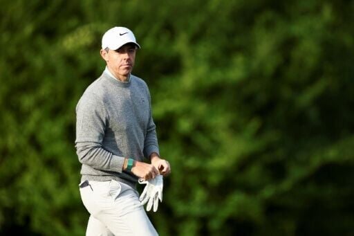 Defending champion Rory McIlroy of Northern Ireland walks on the 13th green during a practice round ahead of the 90th Masters