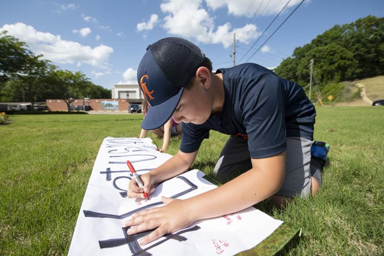 PHOTOS: Children, parents protest for kids to play ball