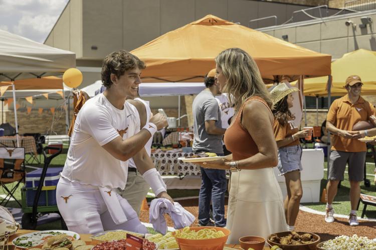 University of Texas quarterback Arch Manning (left) and mother Ellen Manning (right) connect at a family tailgate event, highlighting a shared commitment to cardiovascular health across generations in new national campaign.