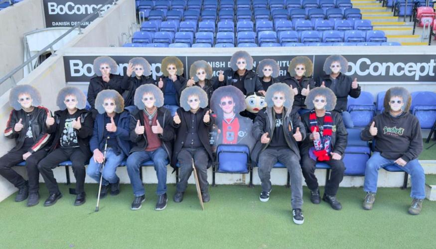 Pals wear masks of late mate’s face at match in tribute to fan after death