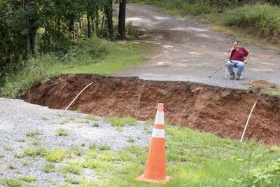 Storm washes out private road, stranding residents