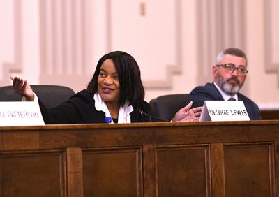 Cliff Williams / TPI Elmore County District Court Judge Place 2 candidate Desirae Lewis, left, speaks at a candidate forum hosted by the Elmore County NAACP. Tray Richardson, right, is also campaigning for the same position.