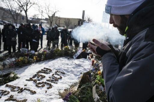 Locals gathered at a makeshift memorial in the area where Alex Pretti was shot dead